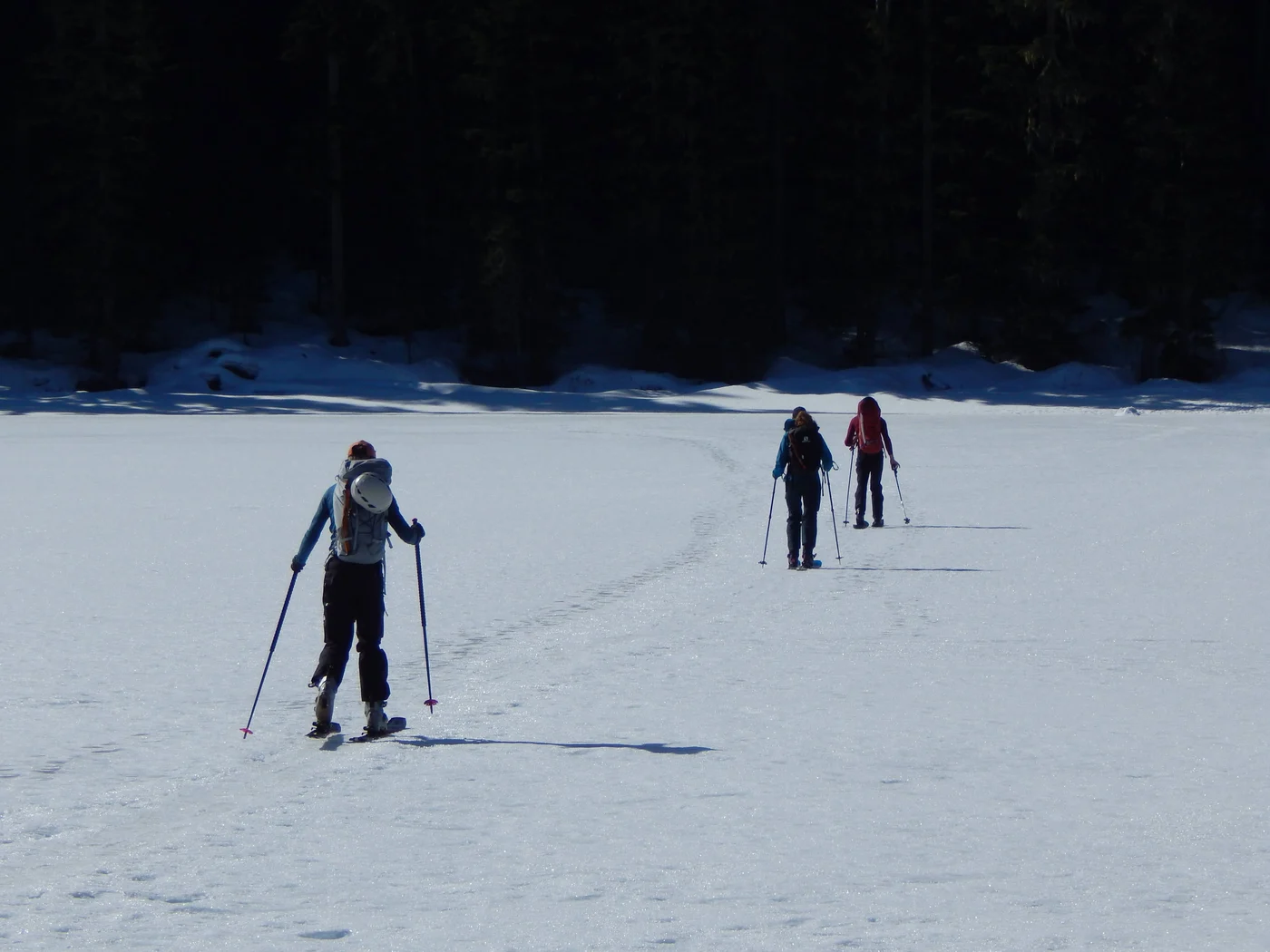 Snowshoeing across winter alpine wilderness